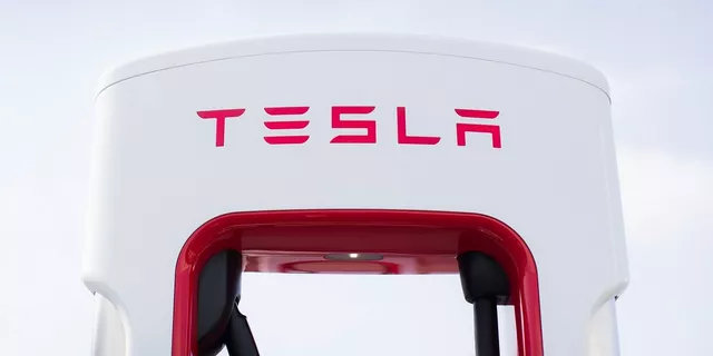 Tesla leads Nasdaq to record highs